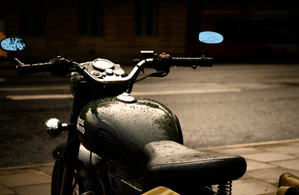 Green motorcycle in the rain