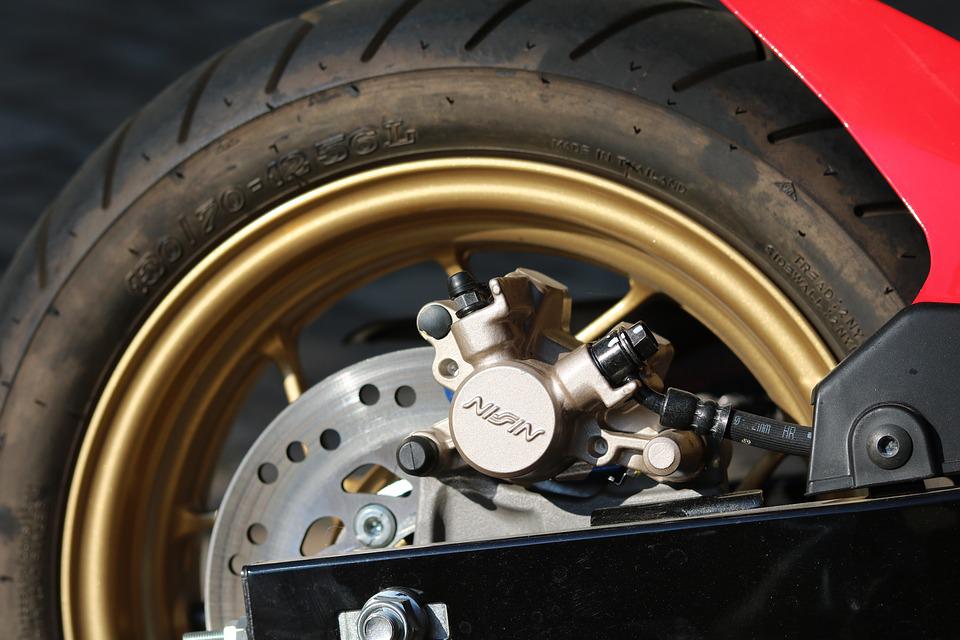 motorcycle tyre on gold rim