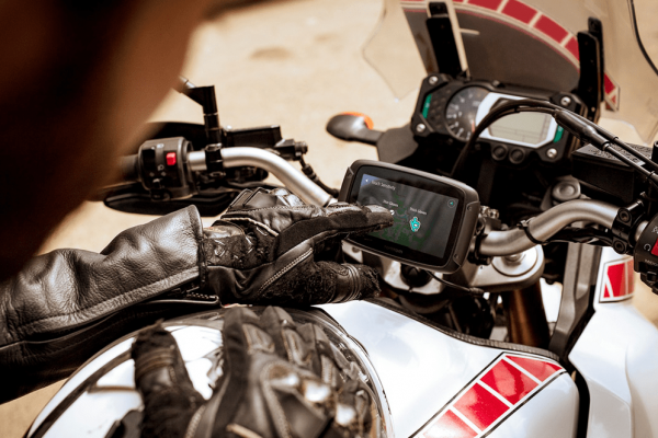 rider interacting with GPS unit